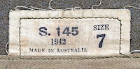 Label located on the inside, rear of the garrison cap showing the manufacturer, year, and size. The S indicates the cap was made in the state of South Australia. Most Australian made enlisted men's clothing had a similar label. Label located on the inside, rear of the garrison cap showing the manufacturer, year, and size. The S indicates the cap was made in the state of South Australia. Most Australian made enlisted men's clothing had a similar label.