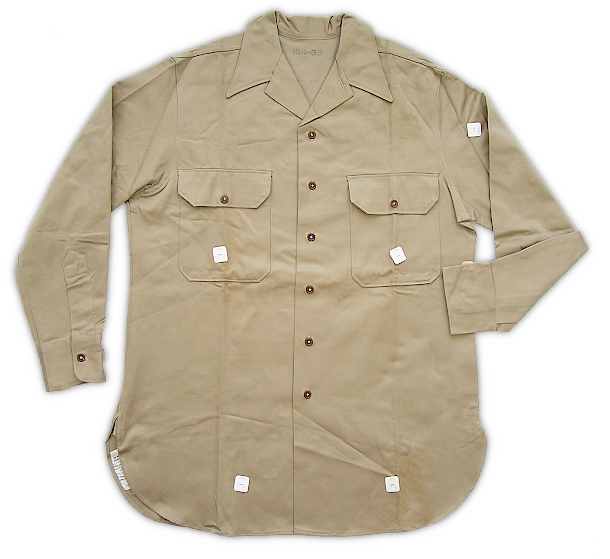Convertible collar khaki cotton shirt (specification PQD 96A, 8 October 1941). Developed for use in the tropics and approved 26 September 1941, this shirt featured a collar that could be worn open sports style without a necktie or buttoned with a necktie. Improvements in the functionality of the collar led to the shirt being approved as standard issue for all troops on 27 November 1941. The convertible collar desgin gradually replaced the specification QMC 6‐241 shirt approved in 1938. Successful implementation of the convertible collar involved eliminating the standing part of the collar, increasing the spacing between the collar button and second button, and removing the front button placket. Convertible collar khaki cotton shirt (specification PQD 96A, 8 October 1941). Developed for use in the tropics and approved 26 September 1941, this shirt featured a collar that could be worn open sports style without a necktie or buttoned with a necktie. Improvements in the functionality of the collar led to the shirt being approved as standard issue for all troops on 27 November 1941. The convertible collar desgin gradually replaced the specification QMC 6‐241 shirt approved in 1938. Successful implementation of the convertible collar involved eliminating the standing part of the collar, increasing the spacing between the collar button and second button, and removing the front button placket.