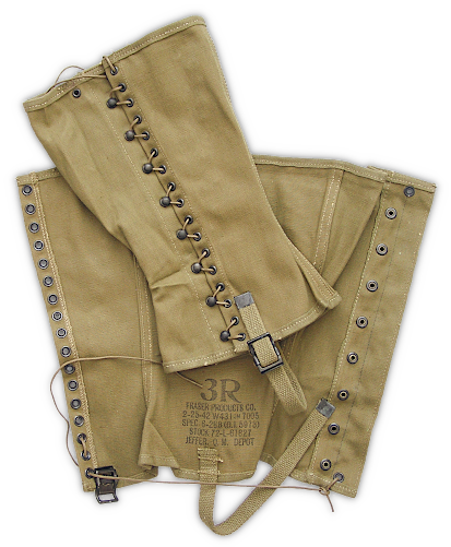 Khaki dismounted M‐1938 canvas leggings (specification QMC 6‐288, 8 August 1940). Leggings were universally adopted by the Army when trousers replaced breeches in 1938. They were worn when campaigning or during field training exercises to protect the lower leg and keep debris out of the shoes and trousers. Height was 12 ¾‐inches and the fabric was heavy No. 6 canvas duck. Leggings were laced over the service shoes using a series of hooks and eyelets with the lower end being secured with a web strap that buckled around the shoe shank. Trousers were tucked in at the top. Olive‐drab shade canvas gradually replaced khaki beginning in 1941. Khaki dismounted M‐1938 canvas leggings (specification QMC 6‐288, 8 August 1940). Leggings were universally adopted by the Army when trousers replaced breeches in 1938. They were worn when campaigning or during field training exercises to protect the lower leg and keep debris out of the shoes and trousers. Height was 12 ¾‐inches and the fabric was heavy No. 6 canvas duck. Leggings were laced over the service shoes using a series of hooks and eyelets with the lower end being secured with a web strap that buckled around the shoe shank. Trousers were tucked in at the top. Olive‐drab shade canvas gradually replaced khaki beginning in 1941.