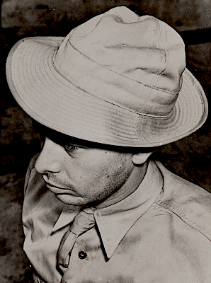 This ACME photo published 25 March 1942 shows a soldier wearing the khaki cotton field hat. The hat offered the soldier protection against the sun and rain and could be conveniently folded and tucked into a pocket when not needed. The brim could be worn up or down in the front or back as desired. This ACME photo published 25 March 1942 shows a soldier wearing the khaki cotton field hat. The hat offered the soldier protection against the sun and rain and could be conveniently folded and tucked into a pocket when not needed. The brim could be worn up or down in the front or back as desired.