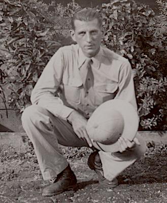 Private John Sabon while stationed in Hawaii in 1942 with his coastal artillery unit. He wears the khaki cotton uniform with necktie and holds the cloth covered fiber helmet. Private John Sabon while stationed in Hawaii in 1942 with his coastal artillery unit. He wears the khaki cotton uniform with necktie and holds the cloth covered fiber helmet.