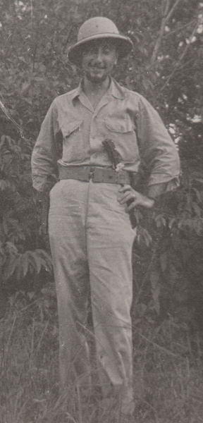 Army Air Force ground personnel in the bush near Waller Field, Trinidad. This man wears the khaki cotton convertible collar shirt open at the neck. He also wears a cloth covered fiber helmet for protection from the sun and surrounding brush. The convertible collar was introduced in 1941 to improve the look and comfort of the khaki shirt when worn with an open collar in hot weather. Note the falling collar that lays flat when open and the absence of a front button placket. Army Air Force ground personnel in the bush near Waller Field, Trinidad. This man wears the khaki cotton convertible collar shirt open at the neck. He also wears a cloth covered fiber helmet for protection from the sun and surrounding brush. The convertible collar was introduced in 1941 to improve the look and comfort of the khaki shirt when worn with an open collar in hot weather. Note the falling collar that lays flat when open and the absence of a front button placket.