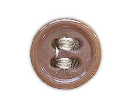 Plastic button used on the khaki cotton shirt shown below. The shirt had a total of eleven 24‐ligne buttons. Seven were used for the front opening, one for each pocket, and one for each cuff. Plastic button used on the khaki cotton shirt shown below. The shirt had a total of eleven 24‐ligne buttons. Seven were used for the front opening, one for each pocket, and one for each cuff.