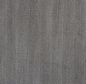 A close‐up of the 8.5‐ounce olive‐drab herringbone twill fabric shows the characteristic alternating diagonal weave creating the fishbone pattern that gives the fabric its name.  Herringbone twill was used by the Army throughout WW2 on both one and two‐piece work uniforms, summer combat uniforms, and one and two‐piece camouflage uniforms.  In the spring of 1943, the color was darkened and designated olive‐drab shade 7.