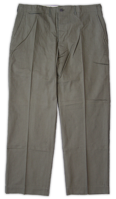 Front view of the herringbone twill trousers.  These trousers were cut in the same pattern as the khaki cotton trousers but were made with 8.5‐ounce herringbone twill instead.  They featured double stitch leg seams, two internally hung front pockets, two internally hung rear pockets, and a watch pocket located at the right, front just below the waistband. 