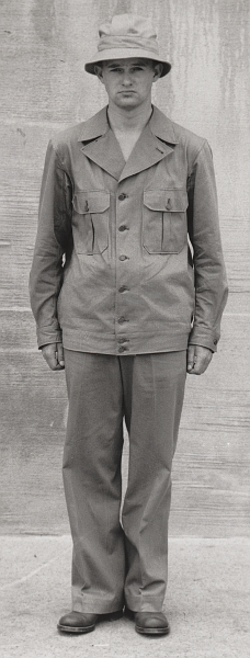 This US Army photograph was taken on 20 June 1941 and showcases the two‐piece herringbone twill work suit.  It was part of a series of official Army photos promoting new uniforms adopted at the time. The uniform is complete as presented with hat, jacket, and trousers.  It appears nothing is being worn underneath the jacket.  The two‐piece herringbone twill suit developed by the Army in 1941 is often referred to as the "first pattern" or "M‐1941" type by collectors and historians.