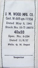 Trousers were also required to have a contractor's label, which was located on the inside attached to the  right, front pocket on the section facing away from the body.  The trousers shown here were manufactured by the J. M. Wood Manufacturing Company of Waco, Texas. Contract 11956 was issued on 9 May 1941 for $65,000 and was completed in November of that same year.  Note the specification number 6‐254 shown on the label is the same used for the Army's Khaki Cotton Trousers.  This specification was amended in 1941 to include the manufacture of herringbone twill trousers.