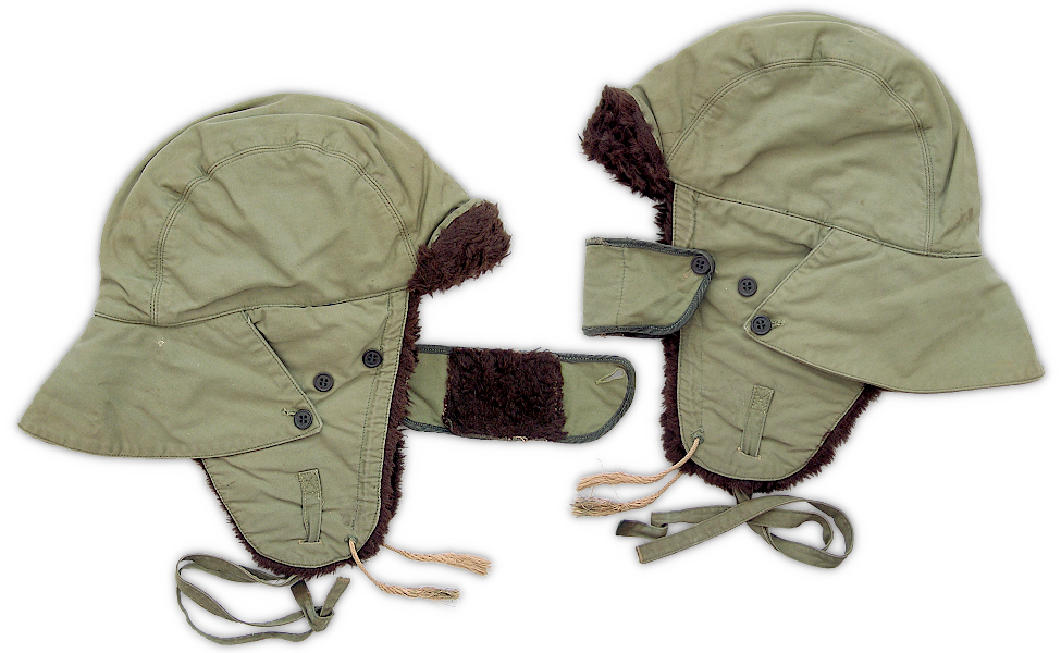Left and right views of the Type I USMC pile lined storm cap. On the left, the face shield is extended in the open position. On the right, the face shield is buttoned across the front. Left and right views of the Type I USMC pile lined storm cap. On the left, the face shield is extended in the open position. On the right, the face shield is buttoned across the front.