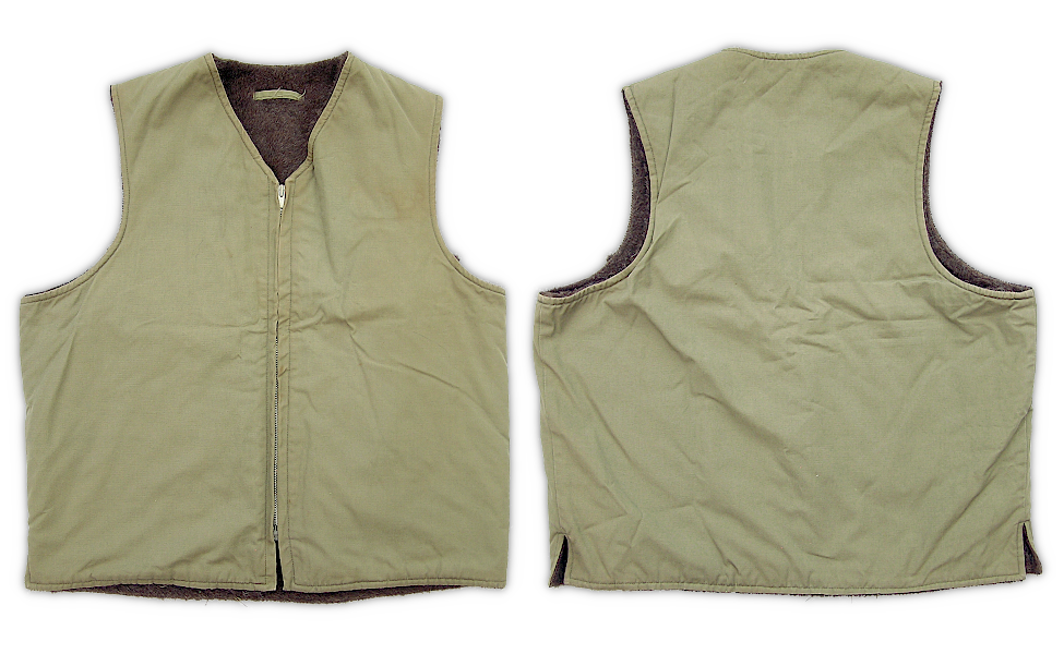 Front and back views of the split hem alpaca pile vest adopted by the Marine Corps during WW2. There were three versions of the USMC vest ‐ one with a button‐up front, one with a zip‐up front and split hem, and one with a zip-up front and solid hem. The vest pictured here is believed to be the second type issued. Front and back views of the split hem alpaca pile vest adopted by the Marine Corps during WW2. There were three versions of the USMC vest ‐ one with a button‐up front, one with a zip‐up front and split hem, and one with a zip-up front and solid hem. The vest pictured here is believed to be the second type issued.