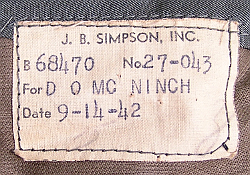 Close-up view of tailor's label found inside Navy aviation winter coat.