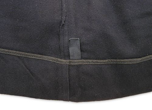 This is a close-up view of the inside bottom hem of the 1944 jumper.  It shows the loop of tape that replaced the eyelets on the old jumper.  One of these loops was present on each side of the jumper near the side seam and was used to string the jumper on a clothes line.  The hem was 2½-inches and could be let down for proper fit.