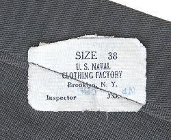 Label for the enlisted men's gray jumper found on the inside skirt seam.