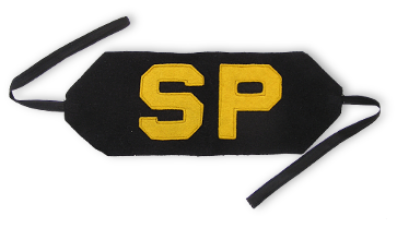 Navy shore patrol brassard worn on the arm opposite the rate badge between the shoulder and elbow.