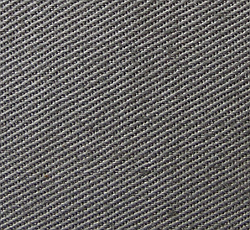 Close-up view of the standard 7.7 ounce cotton twill fabric used in the manufacture of the gray uniform.
