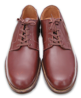 US Navy procured regulation brown low quarter shoes.  Brown shoes were an option for the khaki uniform and were typically worn by aviators.