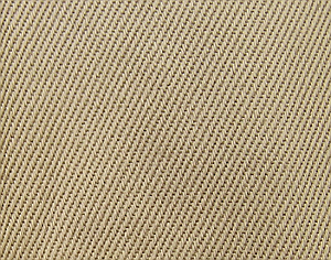 Close-up view of the regulation 8.2 ounce cotton twill fabric used in the manufacture of the khaki coat and trousers. Fabric weight ranged from 7.7 to 8.2 ounces per square yard during the course of the war. Note the distinctive diagonal ridges that characterize this type of fabric.