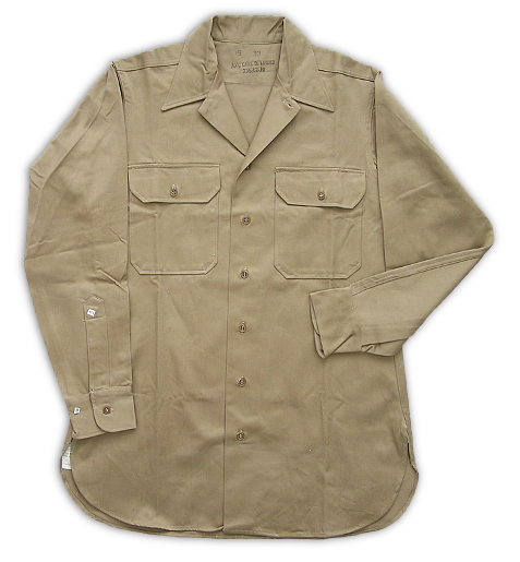 US Army type convertible collar khaki cotton shirt procured by the Navy.  This shirt could be worn with the collar open or closed and was ideal for the hot conditions of the South Pacific where the khaki uniform was most often worn without the coat.   Utilizing the Army design helped manufacturers meet production requirements by reducing the number of different items they had to produce during a time of critical uniform shortages. The Army style shirt was distinctive for its horizontal cut pocket flaps with clipped corners.
