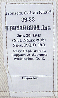 Contractor's label for Army type khaki cotton trousers procured by the US Navy Bureau of Supplies & Accounts.  This contract was issued on 20 January 1943 to O'Bryan Brothers Co. of Nashville, Tennessee.  In the opening months of 1943, the Navy procured tens of thousands of Army specification Khaki shirts and trousers.