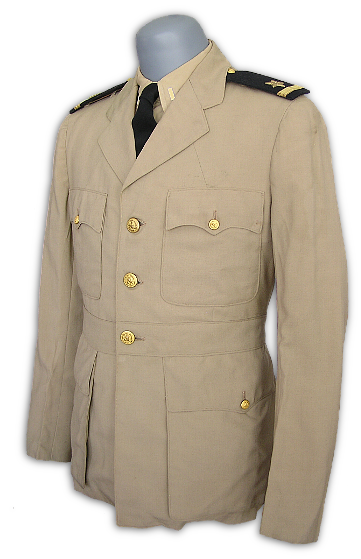 A khaki coat made in light tropical worsted wool as it appeared in the fall of 1943.  In late 1942, the Navy authorized the use of lightweight wools and wool blends as an option for the khaki uniform.  The Army and Marines introduced similar types during the same time.  Khaki Wool uniforms were  used more as a service uniform than for working and were more refined than the cotton type having  either a full or partial rayon lining along with inside pockets.  The emergence of the Khaki wool uniform was a result of the realization that the cotton coat was often too hot for wear in summer and tropical areas and that an open collar shirt and trouser combination was more suitable for such conditions.