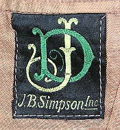 Close-up of the manufacturer's label for the tropical wool coat to the left.